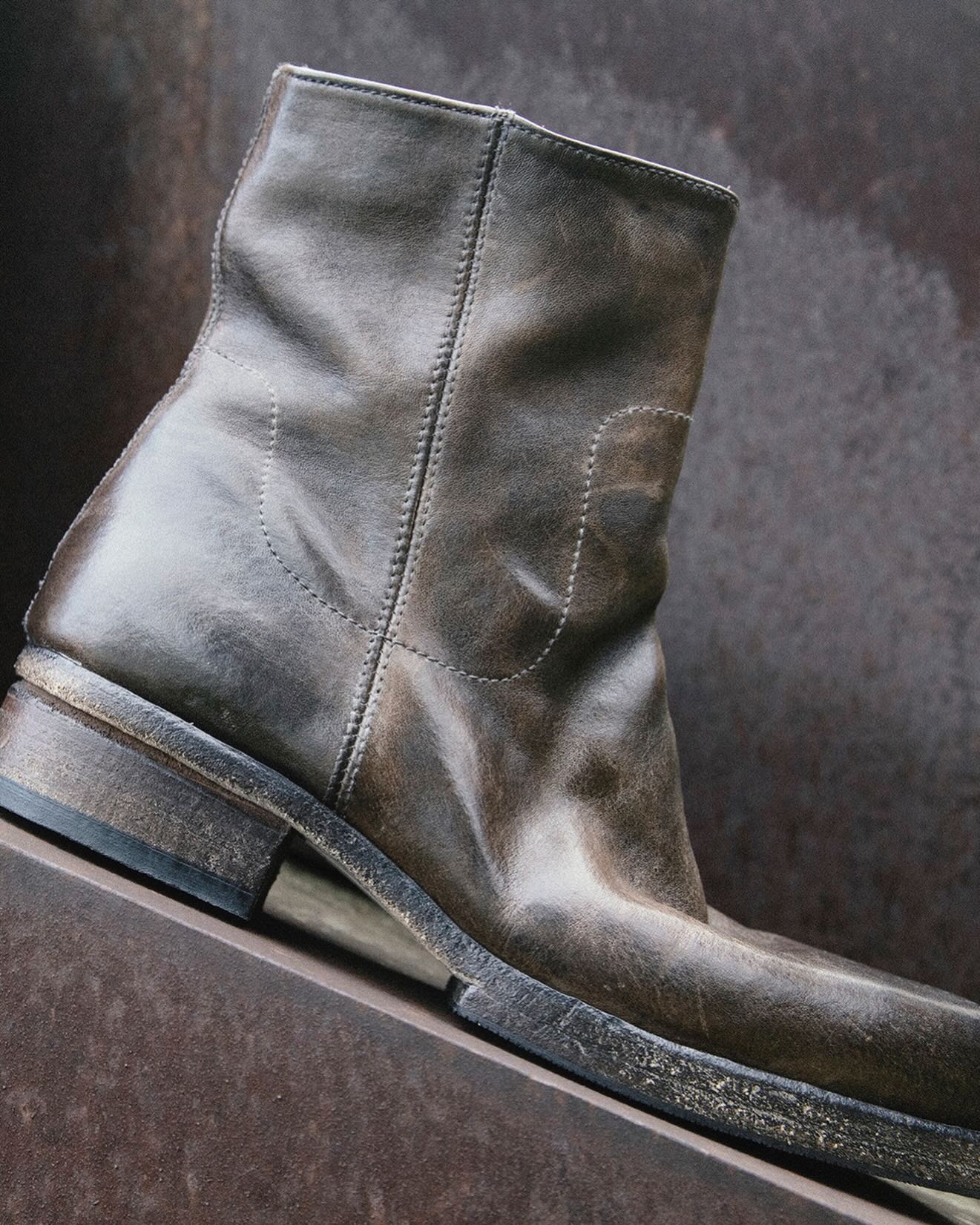 Shoto distressed dark leather ankle boot close-up