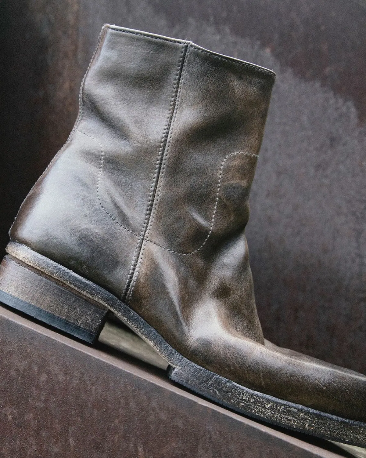 Shoto distressed dark leather ankle boot close-up