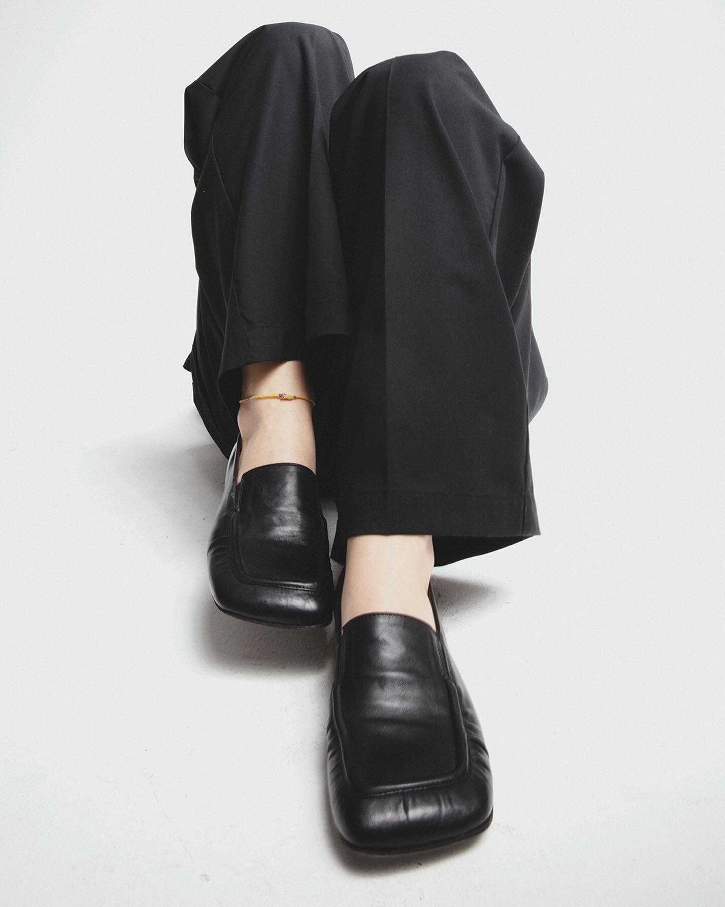 Shoto black square-toe flats with wide trousers