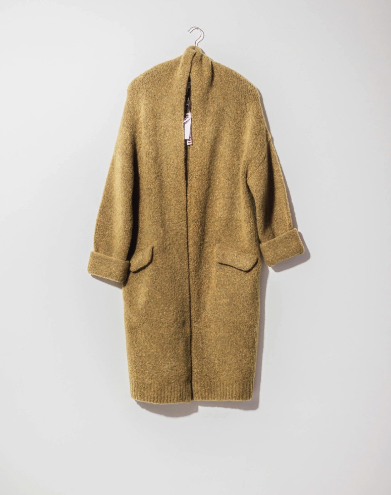 SOH ochre knit coat on a hanger