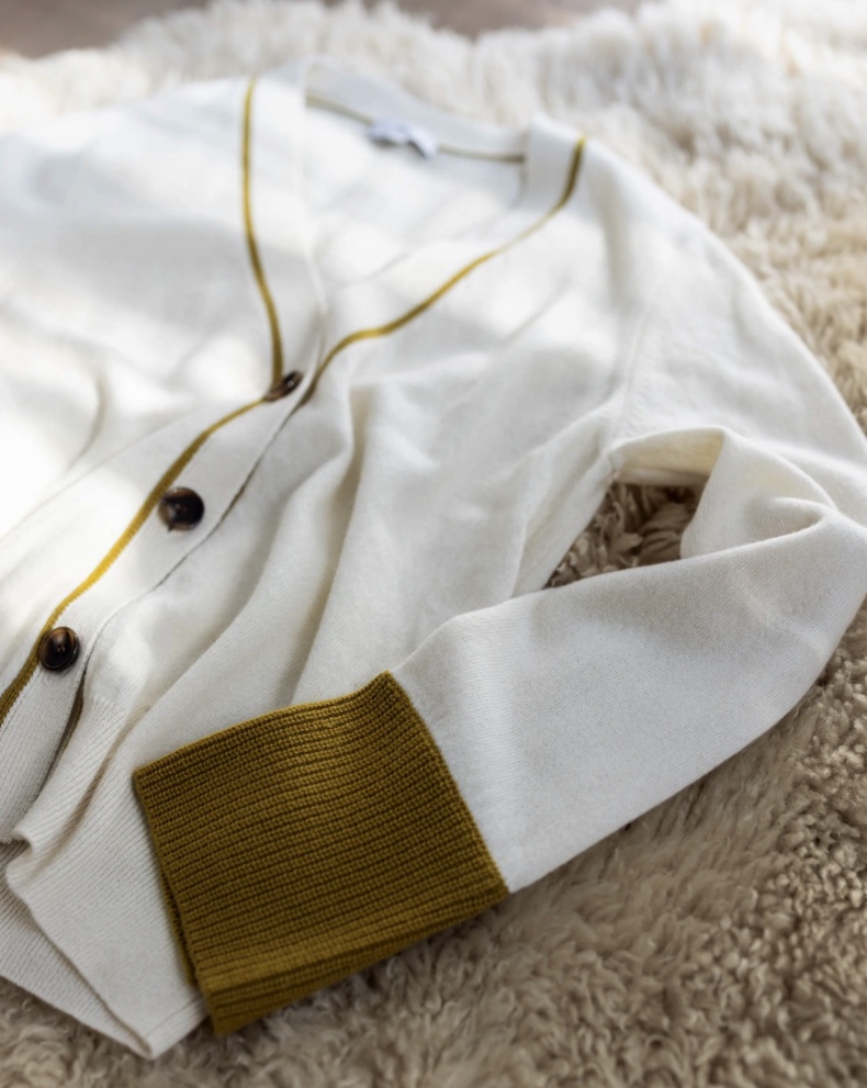 SOH cream cardigan detail with ochre cuffs