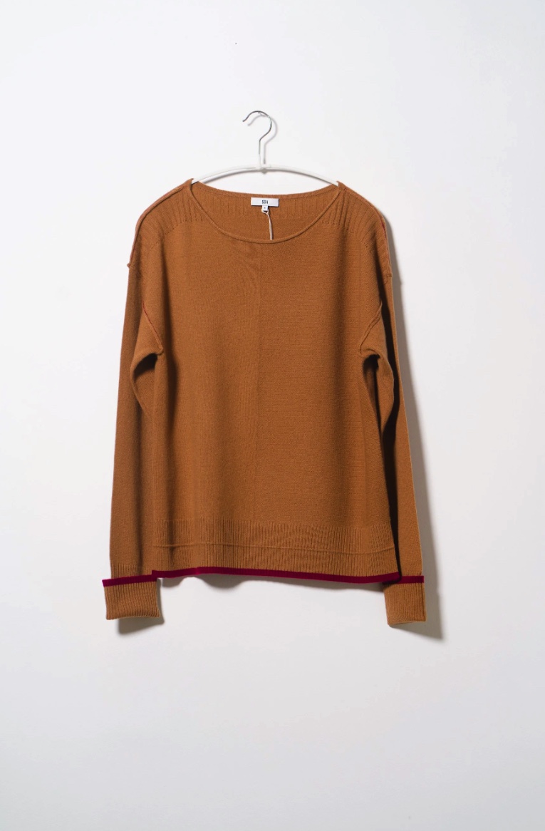 SOH camel sweater with contrast trim on a hanger