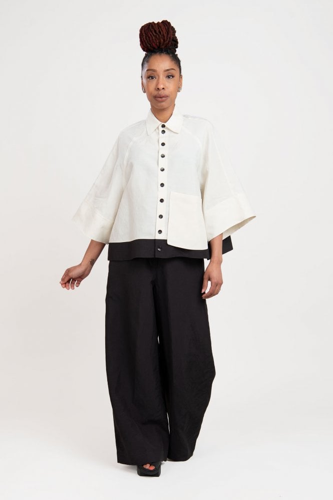 SOH white cropped jacket with wide black trousers